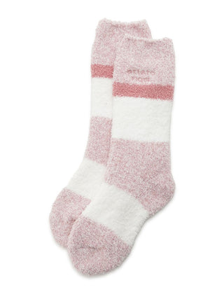 Pink and white striped fuzzy socks, soft and cozy, perfect for cold weather comfort and stylish lounging.
