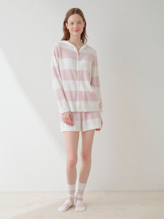 Woman wearing Smoothie Lite 2-Border Lounge Shorts in soft pink and white stripes, showcasing cozy chic style from GELATO PIQUE USA.