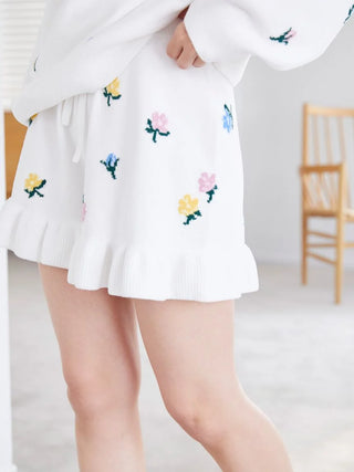 Woman wearing Air Moco Small Flower Lounge Shorts with floral embroidery, showcasing comfortable loungewear from Gelato Pique USA.