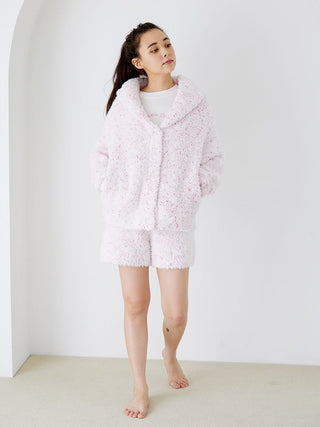 Model wearing fuzzy lounge shorts with drawstring and matching jacket, showcasing cozy speckled pink and white design from Gelato Pique.