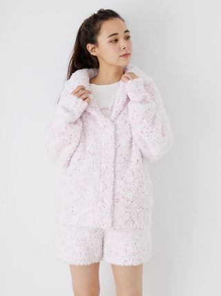 Woman wearing pink fuzzy lounge shorts set with speckled design and drawstring, showcasing cozy loungewear fashion from Gelato Pique.