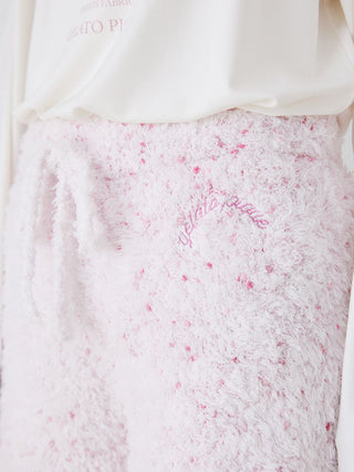 Close-up of Gelato Pique fuzzy lounge shorts with drawstring, featuring a pink speckled design on a soft white fabric.