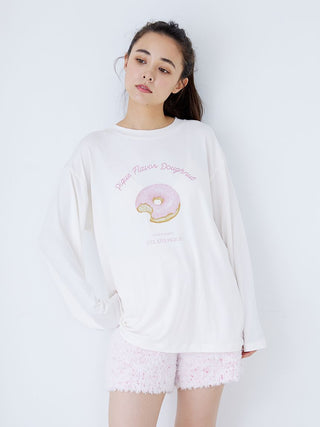 Model wearing fuzzy lounge shorts with drawstring in pink and white speckle, paired with a white long-sleeve donut print top.