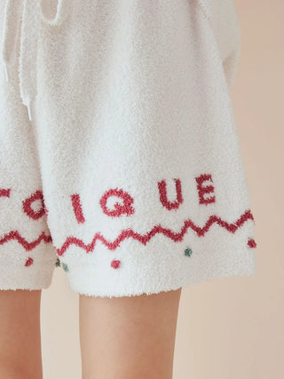 Nordic Lounge Shorts with red 'Gelato Pique' lettering and Nordic-inspired design, offering cozy, ultra-soft fabric for a festive touch.