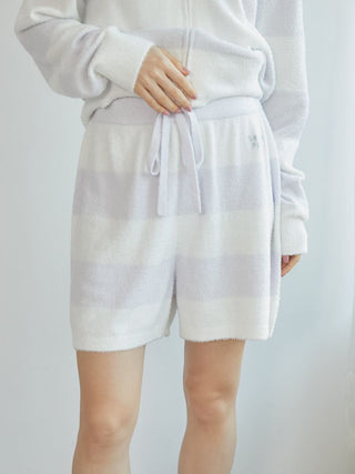 Person wearing Gelato Pique Smoothie 2-Border Lounge Shorts, cozy striped loungewear for comfort and style.