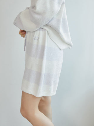 Woman wearing Smoothie 2-Border Lounge Shorts in light gray and white stripes, showcasing cozy and stylish loungewear for everyday comfort.