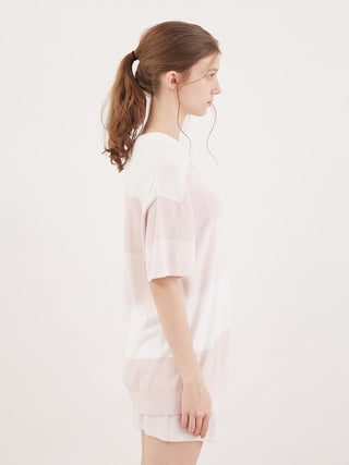 Woman wearing Smoothie Lite striped short-sleeved pullover in pastel colors, side view, showcasing summer loungewear style.