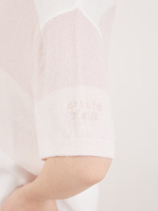 Close-up of Smoothie Lite 3 Striped Short-Sleeved Pullover in sherbet hues, showcasing soft texture and logo detail on sleeve.