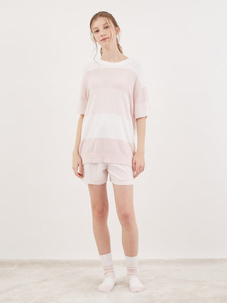 Model wearing Smoothie Lite 3 Striped Short-Sleeved Pullover in pastel pink and white, showcasing summer comfort and style.