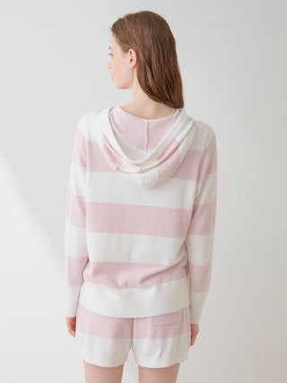 Back view of a woman wearing a Smoothie Lite 2-Border Zip Up Hoodie Cardigan with pastel pink and white stripes.