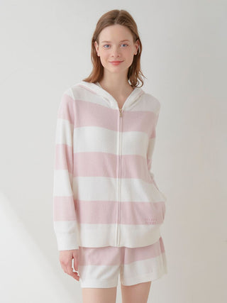 Woman wearing Smoothie Lite 2-Border Zip Up Hoodie Cardigan in pastel pink and white stripes, casual loungewear ensemble.