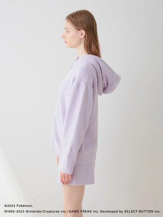 Side view of model wearing Pokémon Sleep Baby Moco Ditto Hoodie & Shorts Set, showcasing cozy fabric in light color.