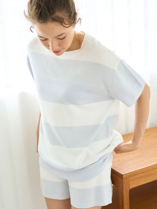 Woman wearing Smoothie Lite 3-Border Lounge Top in light stripes, designed for comfort and style, Gelato Pique, light fabric.