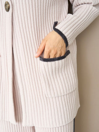 Close-up of Air Moco x Smooth Ribbed Knit Cardigan with contrasting trim and deep pocket detail.