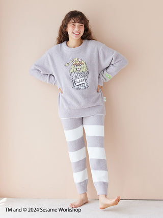 Woman wearing Sesame Street Jacquard Pullover and Long Pants Set made with Baby Moco fabric, featuring character design.