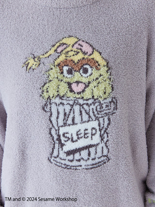 Sesame Street motif on Baby Moco pullover, featuring character in sleep pose. Soft knit suitable for kids, collaboration design.