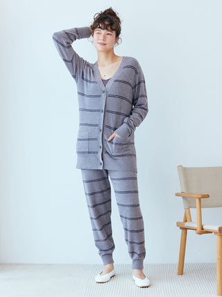Woman wearing Gelato Pique Hot Smoothie Border Cardigan, featuring cozy striped pattern and soft fabric, standing indoors.