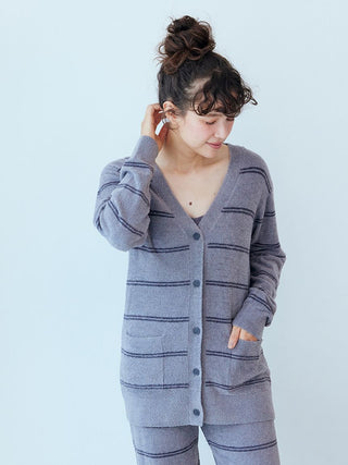 Woman wearing Gelato Pique Hot Smoothie Border Cardigan in striped pattern, showcasing cozy and stylish warmth.
