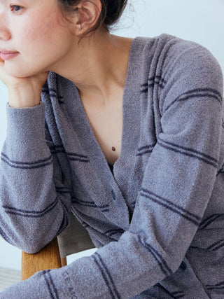 Hot Smoothie Border Cardigan in gray with stripes, featuring a soft textured fabric for warmth and style, worn by a seated person.