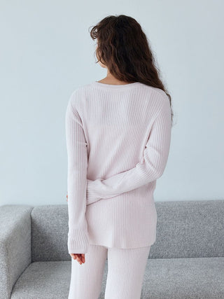 Back view of a woman wearing a Gelato Pique Hot Smoothie Rib Pullover Sweater, showcasing ribbed texture and cozy fit.