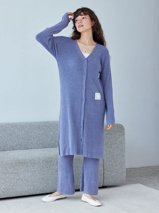 Model wearing luxurious Hot Smoothie Ribbed Long Cardigan in blue, showcasing its soft, sleek design and ribbed texture for stylish loungewear.