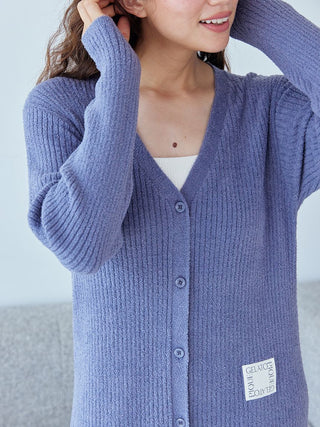 Person wearing a blue Gelato Pique Hot Smoothie Ribbed Long Cardigan, showcasing button detail and soft ribbed texture.