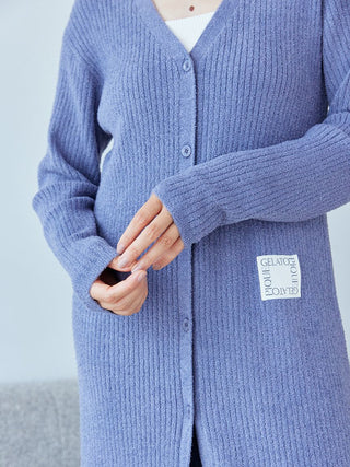 Person wearing a purple Gelato Pique Hot Smoothie Ribbed Long Cardigan with buttons and ribbed texture.