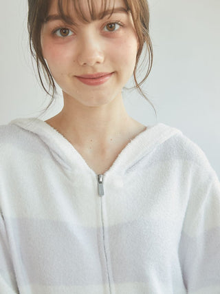 Model wearing Smoothie 2-Border Zip-Up Hoodie in soft fabric with subtle stripe design, ideal for cozy loungewear.
