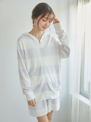 Woman wearing Smoothie 2-Border Zip-Up Hoodie from Gelato Pique, featuring a soft 2-border stripe design, perfect for casual wear and lounging.