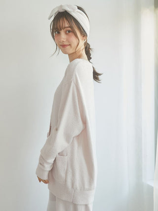 Woman wearing Smoothie Button-Up Cardigan in soft beige, showcasing its plush and cozy fabric, ideal for lounging or everyday wear.