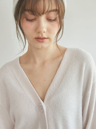 Woman wearing a Smoothie Button-Up Cardigan by Gelato Pique USA, showcasing its plush, lightweight fabric and classic button-up design.
