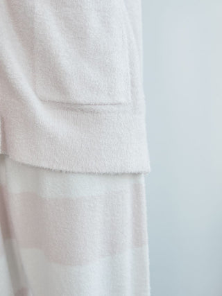 Close-up of Smoothie Button-Up Cardigan by Gelato Pique USA, showcasing soft pink fabric texture with pocket detail.
