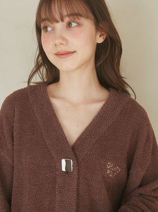 Woman wearing Babymoco Chocolate Button-Up Cardigan from Gelato Pique USA, showcasing its softness and cozy feel. Perfect for chilly days.