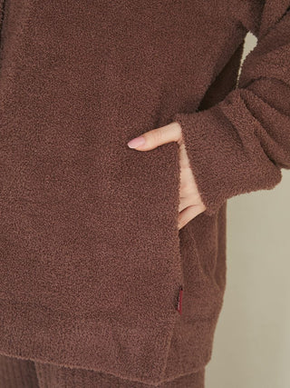 Person wearing a Babymoco Chocolate Button-Up Cardigan showing soft fabric texture and design details.