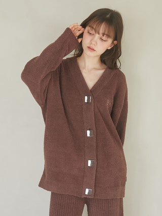 Woman wearing Babymoco Chocolate Button-Up Cardigan, showcasing its soft, warm fabric and stylish design.