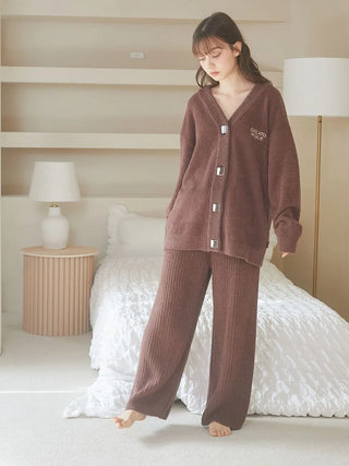 Woman wearing Babymoco Chocolate Button-Up Cardigan in cozy bedroom setting.