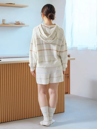 Back view of woman in Smoothie Colorful Zip-Up Hoodie by Gelato Pique USA, featuring cozy fabric and subtle colorful stripes.