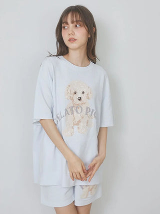 A woman wearing a Gelato Pique USA Toy Poodle Relax Fit T-Shirt featuring premium loungewear with a cute toy poodle design.