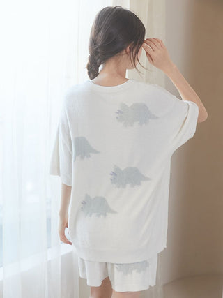 Back view of woman wearing Smoothie Dinosaur Pullover and Shorts Loungewear Set with dinosaur motif, in cozy fabric by Gelato Pique USA.