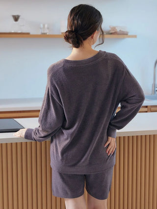 Woman wearing Smoothie Lite cardigan by Gelato Pique USA, a premium loungewear piece, standing in a modern kitchen interior.