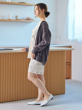 Woman wearing Smoothie Lite Hoodie Jacket from Gelato Pique USA, showcasing premium loungewear and sleepwear in a casual setting.