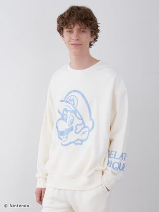 Unisex Super Mario fleece pullover with blue foam Mario print, worn by a model, features comfortable cotton-lined fabric.