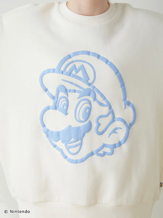 Close-up of SUPER MARIO™️ unisex fleece pullover with a blue puff print of Mario's face on soft white fabric.