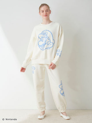 Unisex fleece set with Super Mario and Boo print, featuring white pullover and long pants, soft cotton fabric with elasticized hems.
