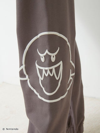 Close-up of Super Mario unisex fleece pants featuring a three-dimensional Boo print on soft, fluffy cotton-lined fabric.