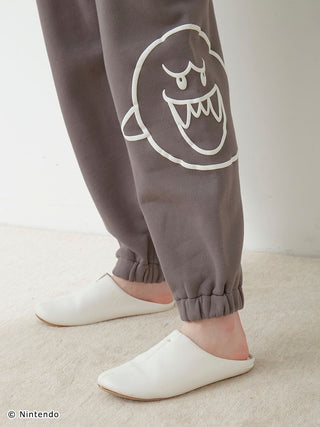 Close-up of dark pants with Boo print from SUPER MARIO™️ Unisex Fleece Pullover & Long Pants Set, featuring elasticized hems.
