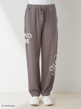 Unisex long pants with Mario and Boo print, elastic hems, and cotton lining.