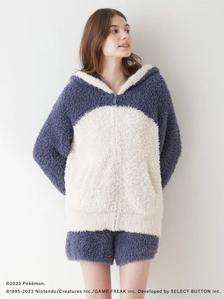 Woman wearing GELATO Snorlax Hoodie & Shorts Set from Pokémon Sleep collection; cozy, fluffy outfit.