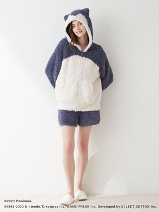 Model wearing Pokémon Sleep GELATO Snorlax Hoodie & Shorts Set, cozy blue and white loungewear with pockets, inspired by Snorlax.