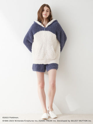Person wearing Pokémon Sleep GELATO Snorlax Hoodie & Shorts Set, featuring cozy blue and white design.
